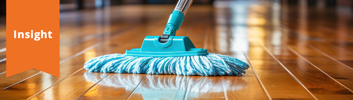 a close-up of a mop, sweeping a floor