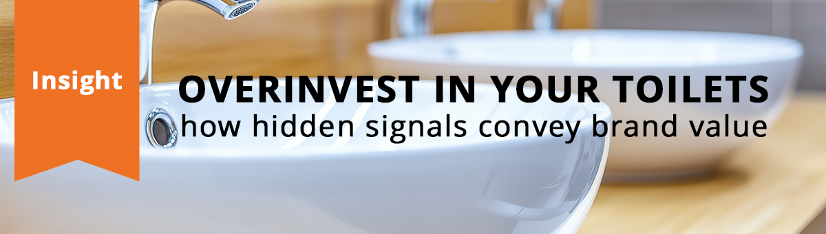 a row of pristine washbasins in a public bathroom