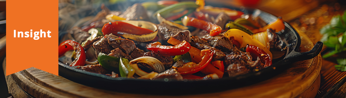 close-up of a tantalizing, sizzling hot fajita plate