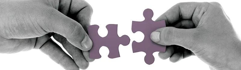 two puzzle pieces to illustrate communication